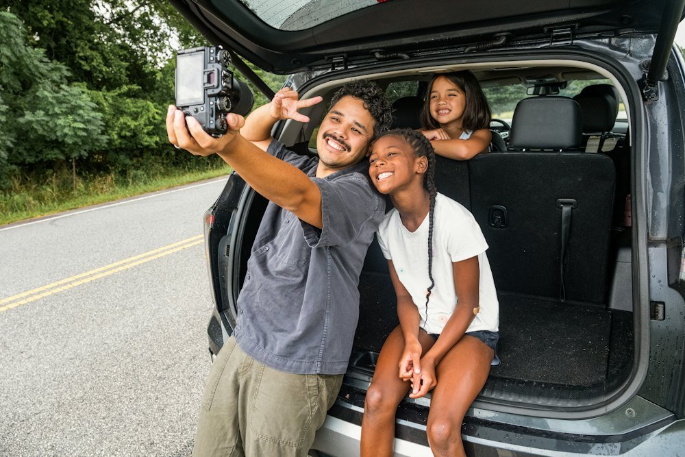 Family enjoying a road trip